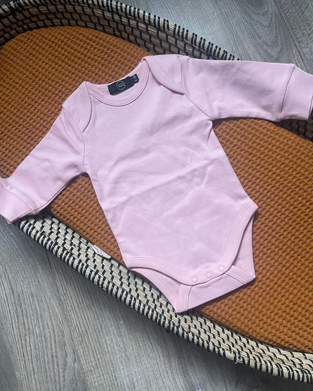 Lange mouw baby en dreumes romper in roze