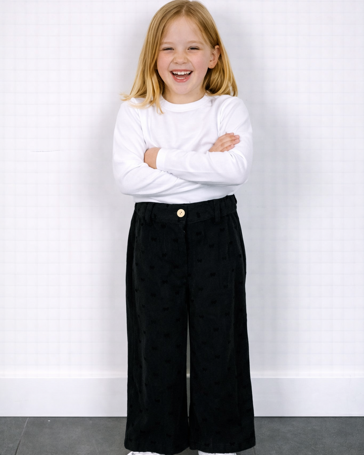 Zwarte strikjes broek