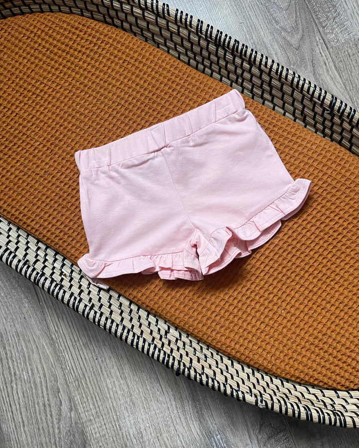 Meisjes baby en dreumes roze kort broekje met ruffles