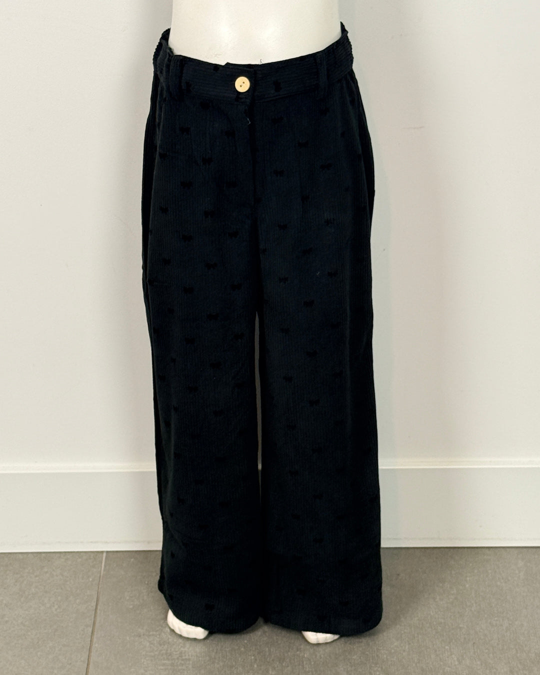 Zwarte broek met strikjes motief