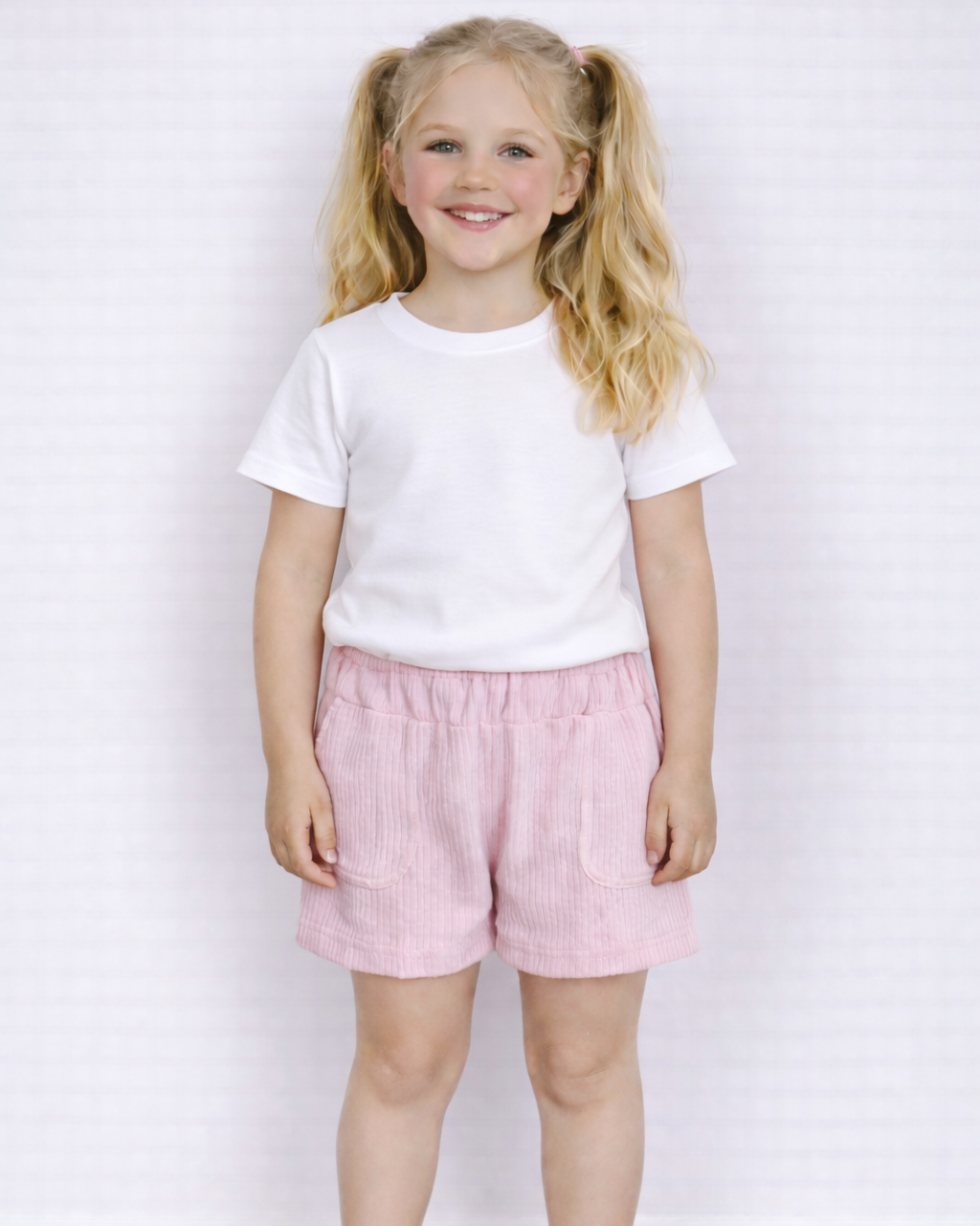Broekje roze met strikjes